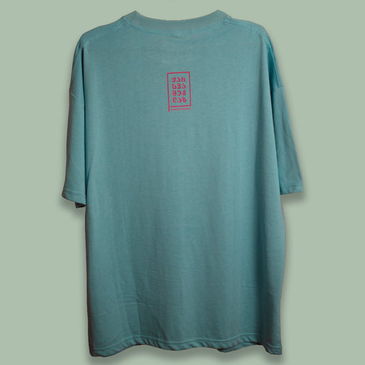 Back view of a pale green Tholige T-shirt