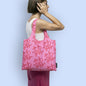 Pink foldable tote bag with the Live Your Own Life print