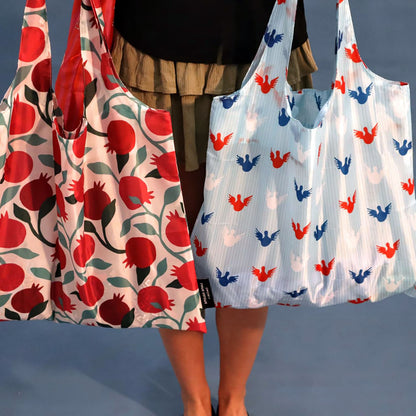 Sky-blue Angels tote bag shown from the back