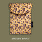 Yellow polyester laptop sleeve with Tholige Georgian ornament print by Giovanni Morra