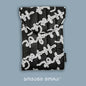 Black polyester laptop sleeve with Live Your Own Life Georgian lettering print by Giovanni Morra