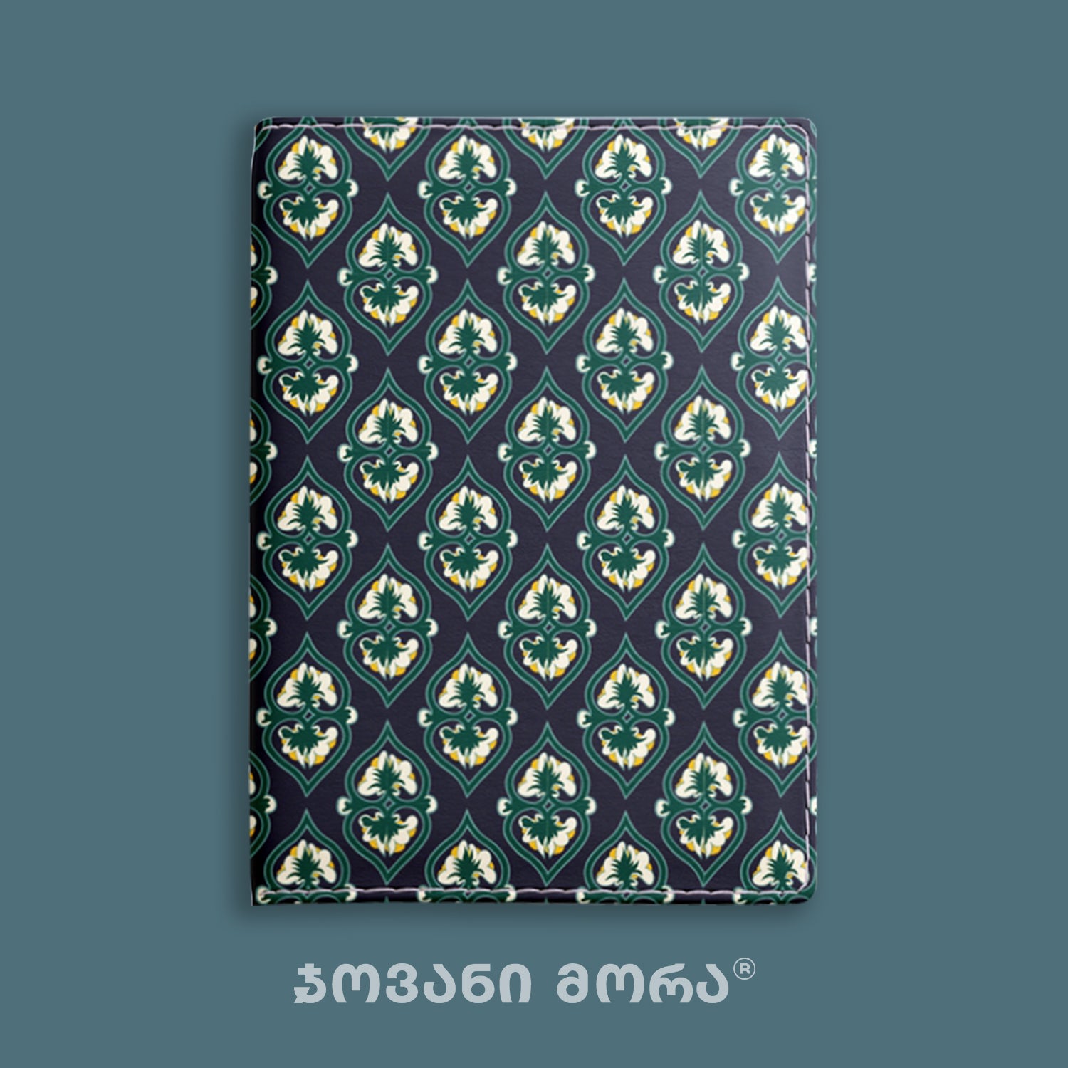 Folded green Beloved vegan leather passport holder with Georgian textile ornament