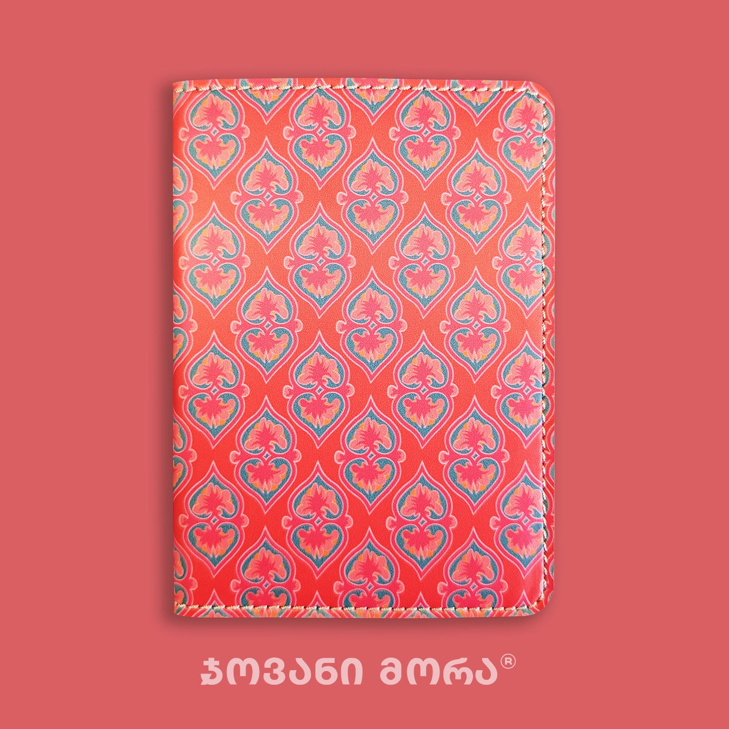 Folded red Beloved vegan leather passport holder with Georgian textile ornament