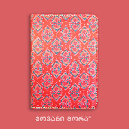 Folded red Beloved vegan leather passport holder with Georgian textile ornament