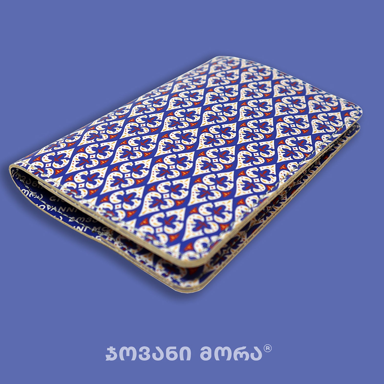 Folded blue vegan leather passport holder with Affection print by Giovanni Morra