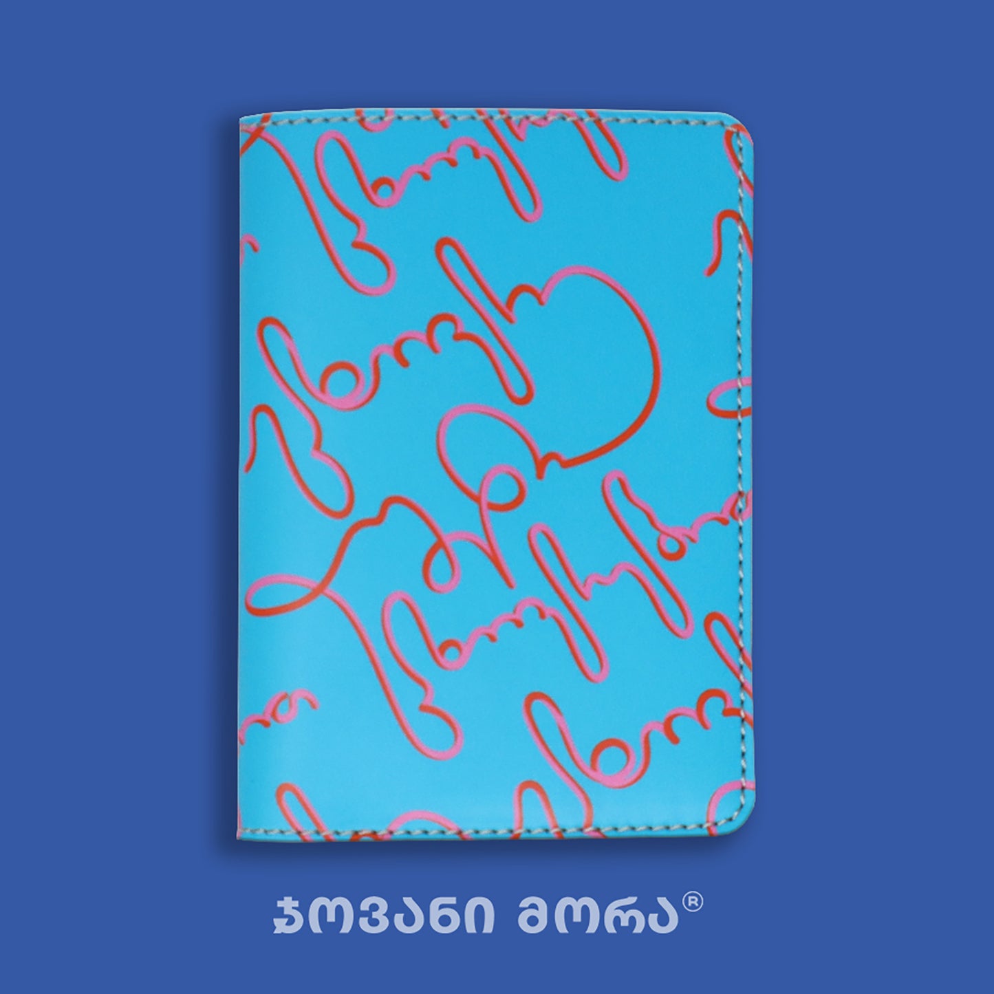Folded light blue and pink vegan leather passport holder with Live Your Own Life print by Giovanni Morra