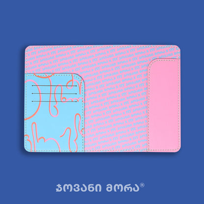 Inside view of light blue and pink Live Your Own Life passport holder by Giovanni Morra