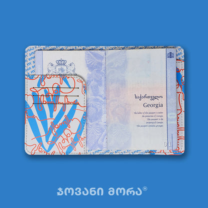 Inside view of beige and red Live Your Own Life passport holder with Georgian passport