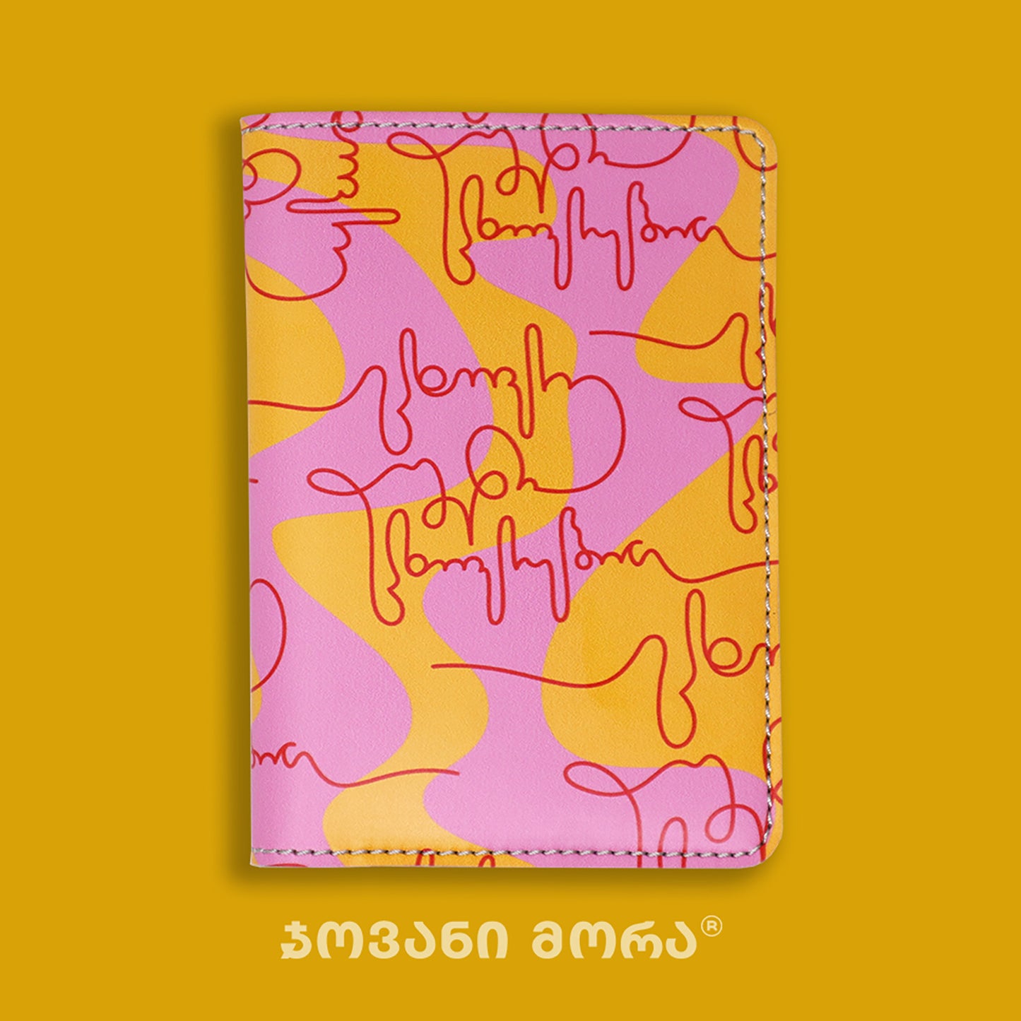 Folded pink, yellow, and red vegan leather passport holder with Live Your Own Life print by Giovanni Morra