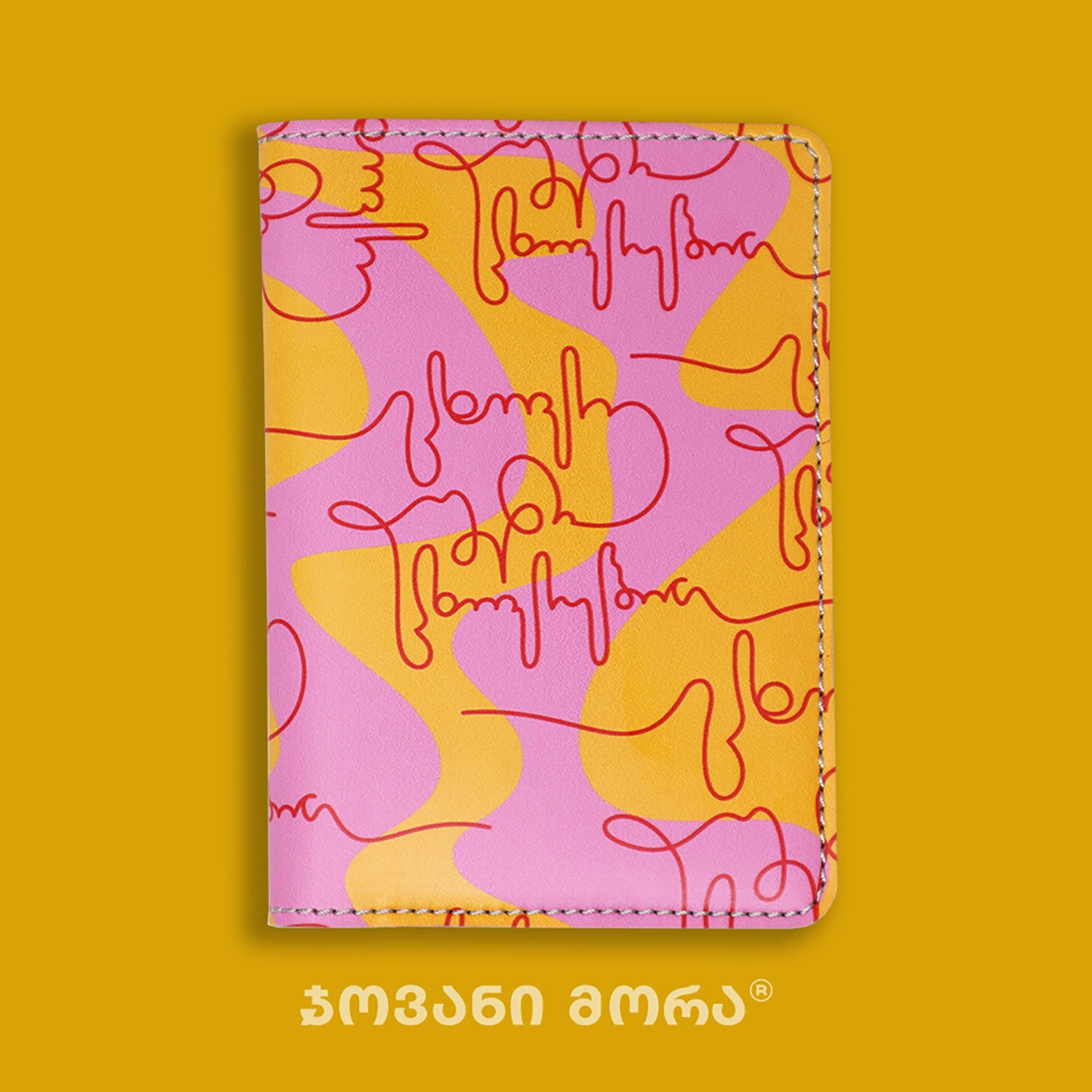 Folded pink, yellow, and red vegan leather passport holder with Live Your Own Life print by Giovanni Morra