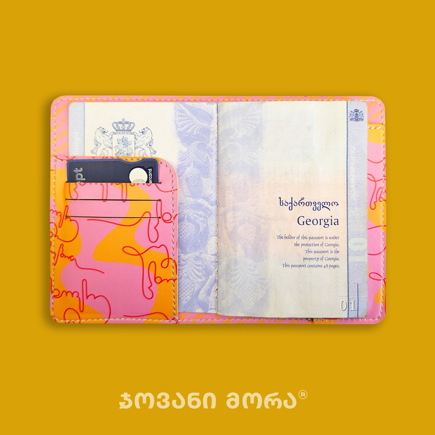 Inside view of Live Your Own Life passport holder with Georgian passport