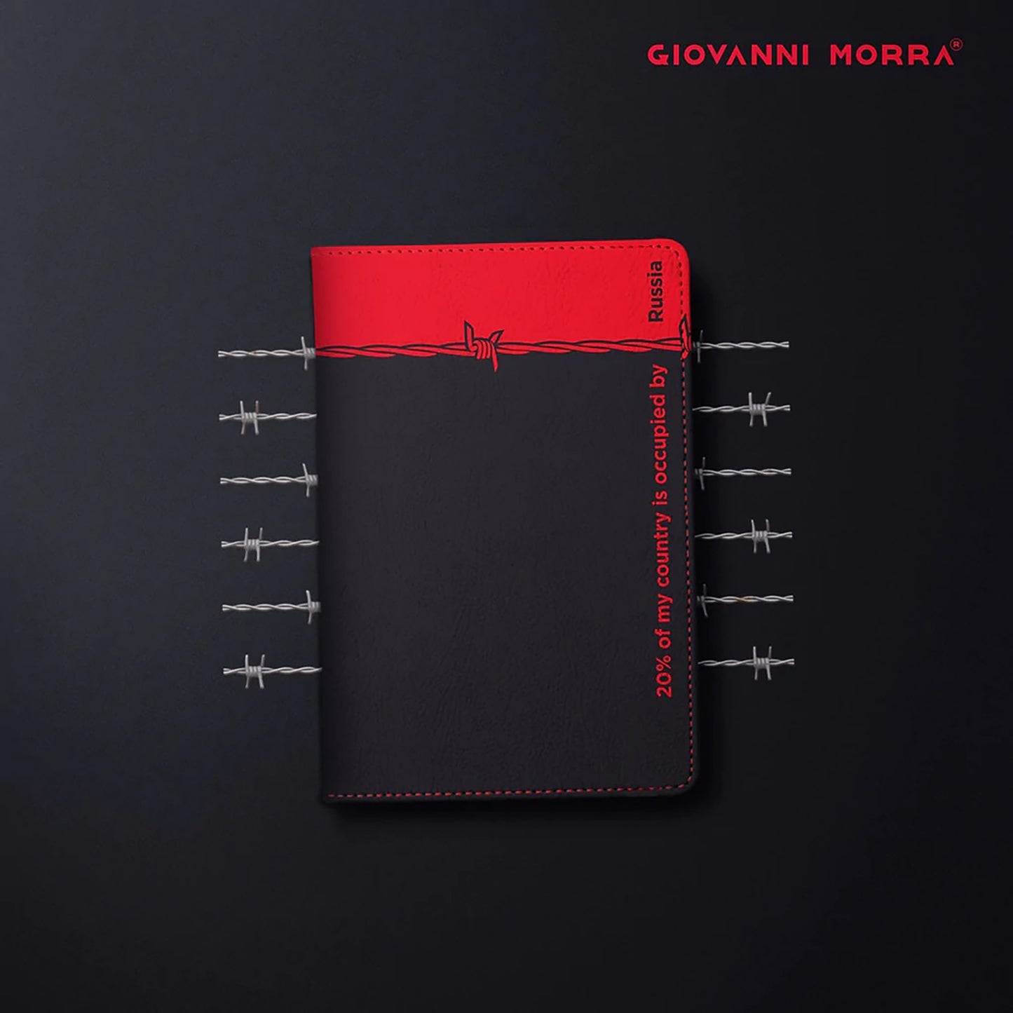 Folded black and red vegan leather passport holder with Occupation print by Giovanni Morra