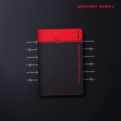 Folded black and red vegan leather passport holder with Occupation print by Giovanni Morra