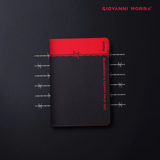 Folded black and red vegan leather passport holder with Occupation print by Giovanni Morra