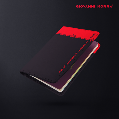 Folded black and red vegan leather passport holder with Occupation print by Giovanni Morra