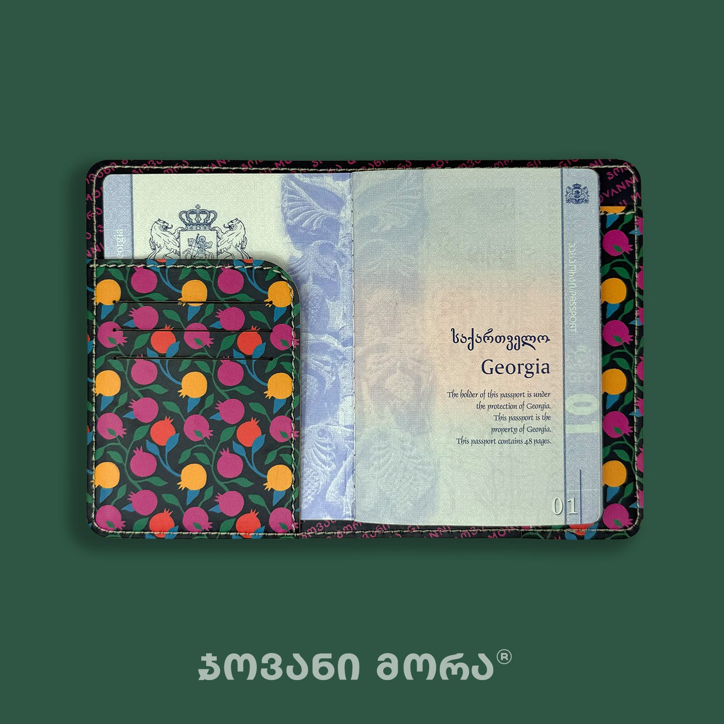 Open black Pomegranates passport holder with passport