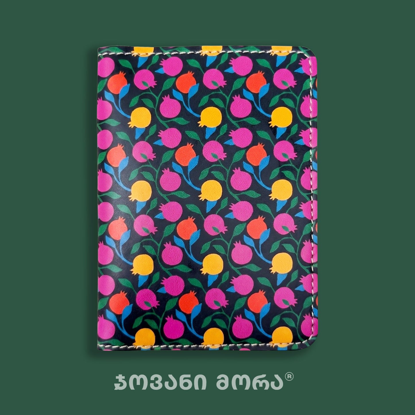 Close-up of the colorful Pomegranates print on a passport holder