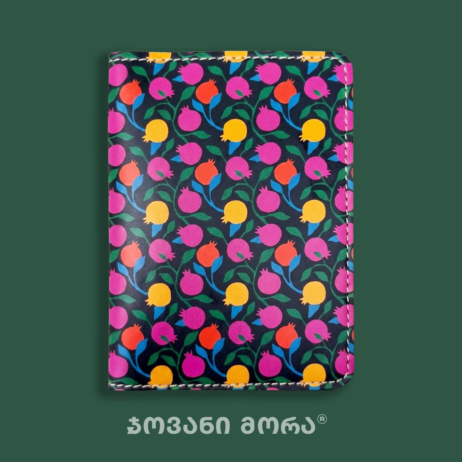 Close-up of the colorful Pomegranates print on a passport holder