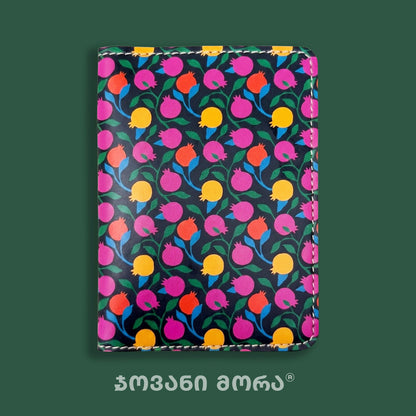 Close-up of the colorful Pomegranates print on a passport holder