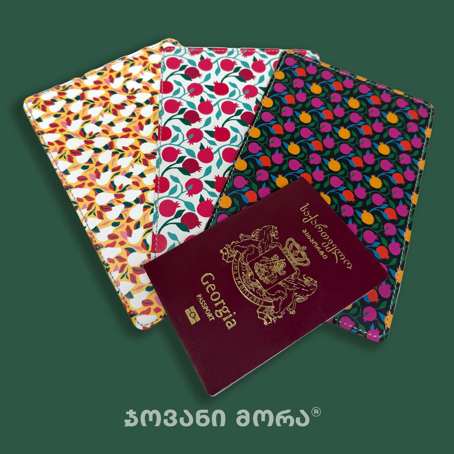 Four colorful passport cover sleeves with different floral and fruit patterns are displayed on a dark green background, with a Georgian passport placed on top.