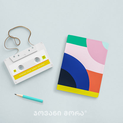 Rainbow passport holder styled with colorful objects by Giovanni Morra