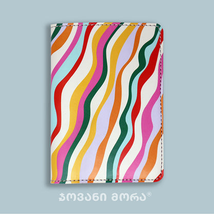 Folded multicolor vegan leather passport holder with Waves print by Giovanni Morra
