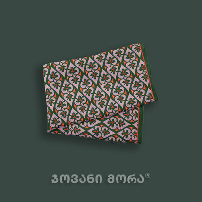 Folded green Affection natural silk scarf featuring a Georgian royal textile ornament