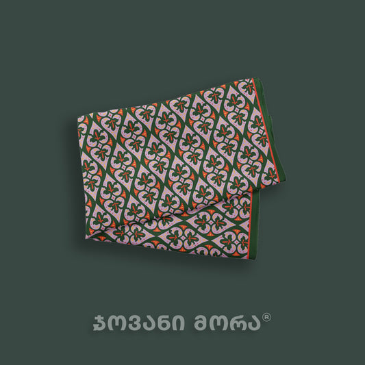 Folded green Affection natural silk scarf featuring a Georgian royal textile ornament