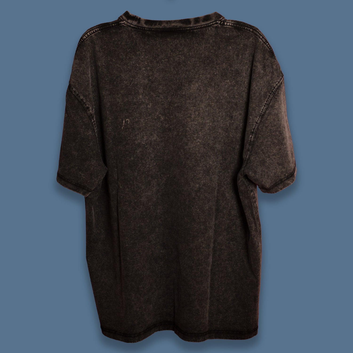 Back view of a black acid-washed oversized T-shirt