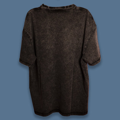 Back view of a black acid-washed oversized T-shirt