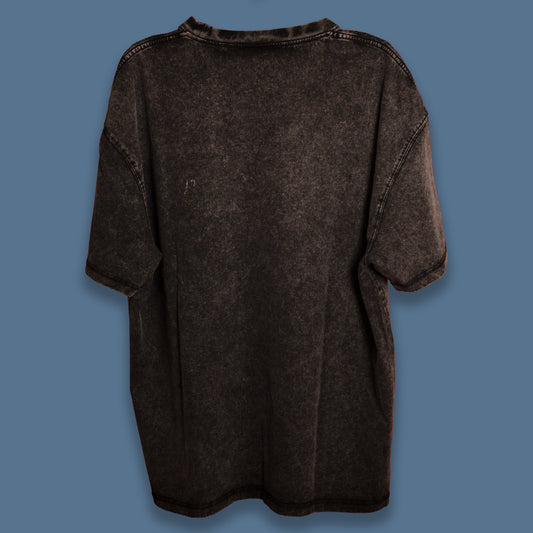 Back view of a black acid-washed oversized T-shirt