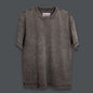 Black acid-washed T-shirt with a tonal Georgian-script logo