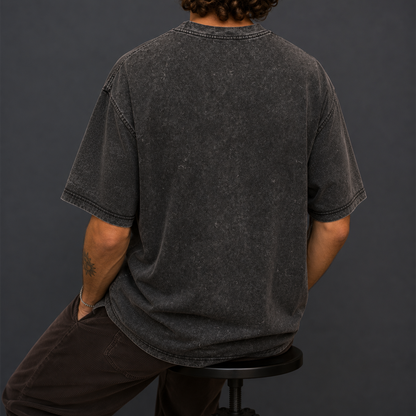 Back view of a black acid-washed oversized T-shirt