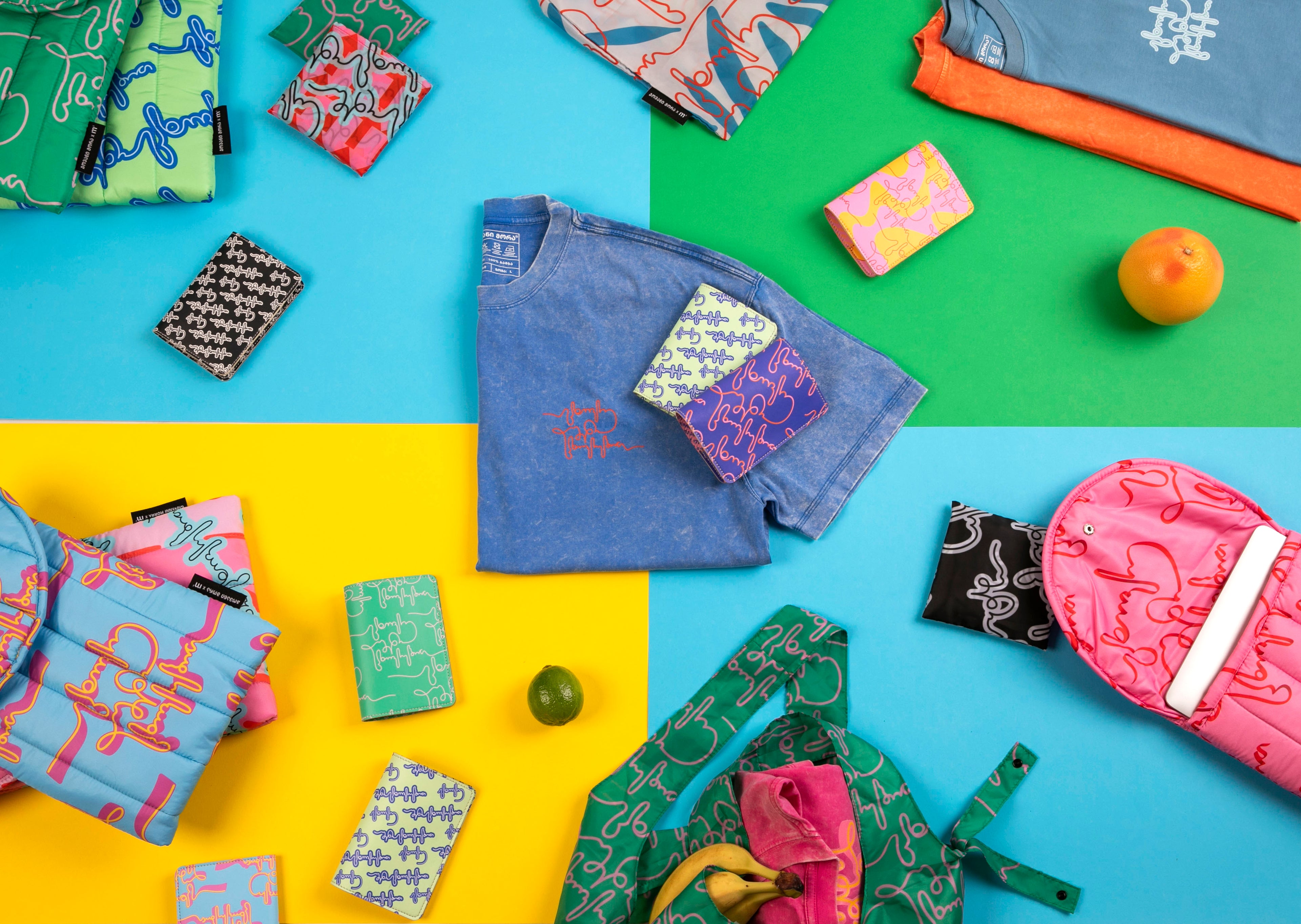 Colorful assortment of patterned bags and pouches on a multicolored background