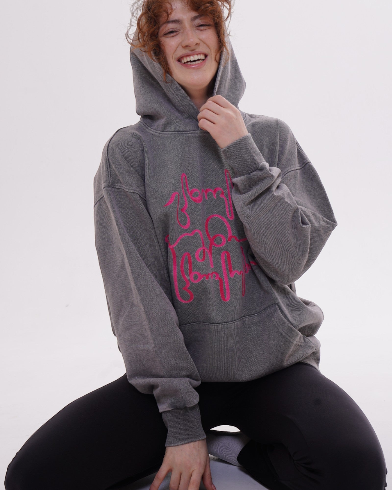 Giovanni Morra x m2 collaboration hoodie featuring the "Live Your Own Life" manifesto in minimalist typography.